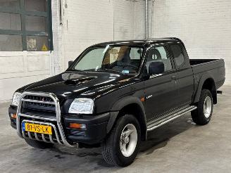 damaged passenger cars Mitsubishi L-200 2.5 TDI Pick-up  Diesel 2.477cc 73kW (99pk) RWD 1e eigenaar 2000/10