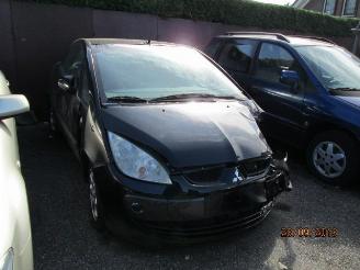 Vaurioauto  passenger cars Mitsubishi Colt 1.5 cabrio 2006/10
