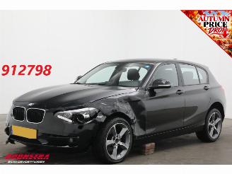Damaged car BMW 1-serie 116i Business Cruise Navi Airco SHZ PDC 2015/2