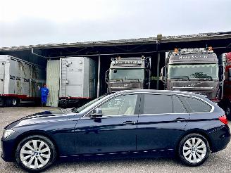 Schadeauto BMW 3-serie Touring 320i 184pk 8-traps aut High Executive - nap - xenon - beige leer - stoelverw - navi - pdc - elektr klep 2014/1