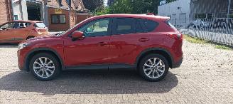 škoda osobní automobily Mazda CX-5 2.2 175pk Automatik 4x4 Navigatie Xenon Climatecontrol CruiseControl Stoelverwarming Lichtautomaat Privacyglas Regensensor Achteruitrijcamera Keyless entry 2014/7